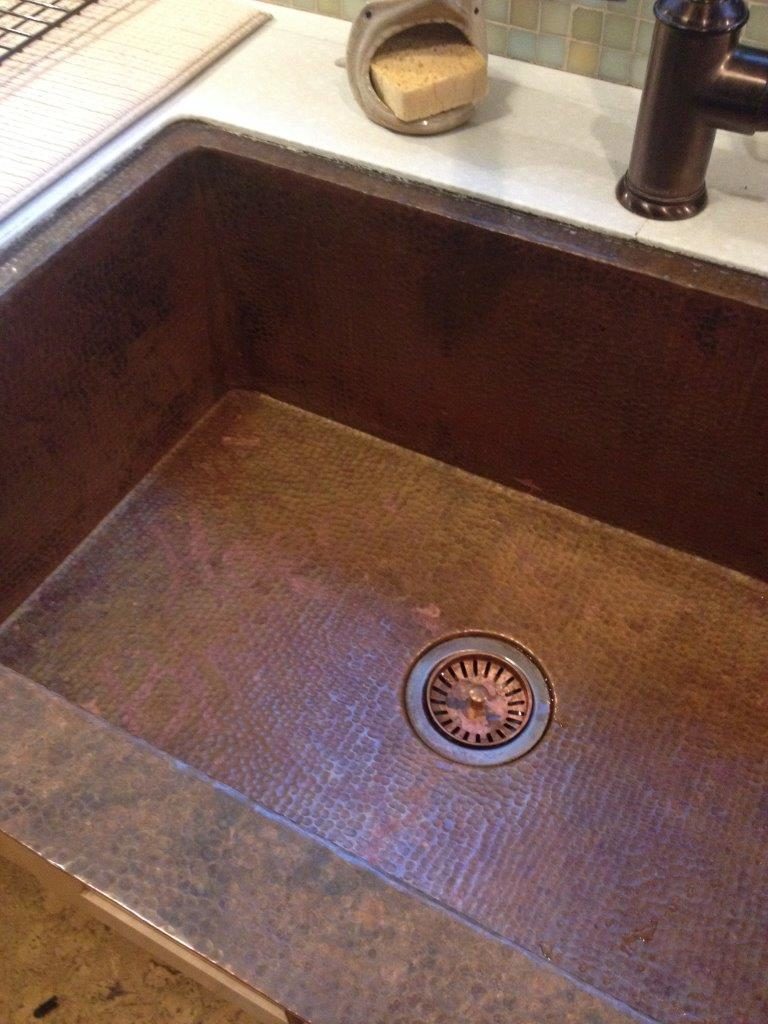 Copper sink with repaired patina