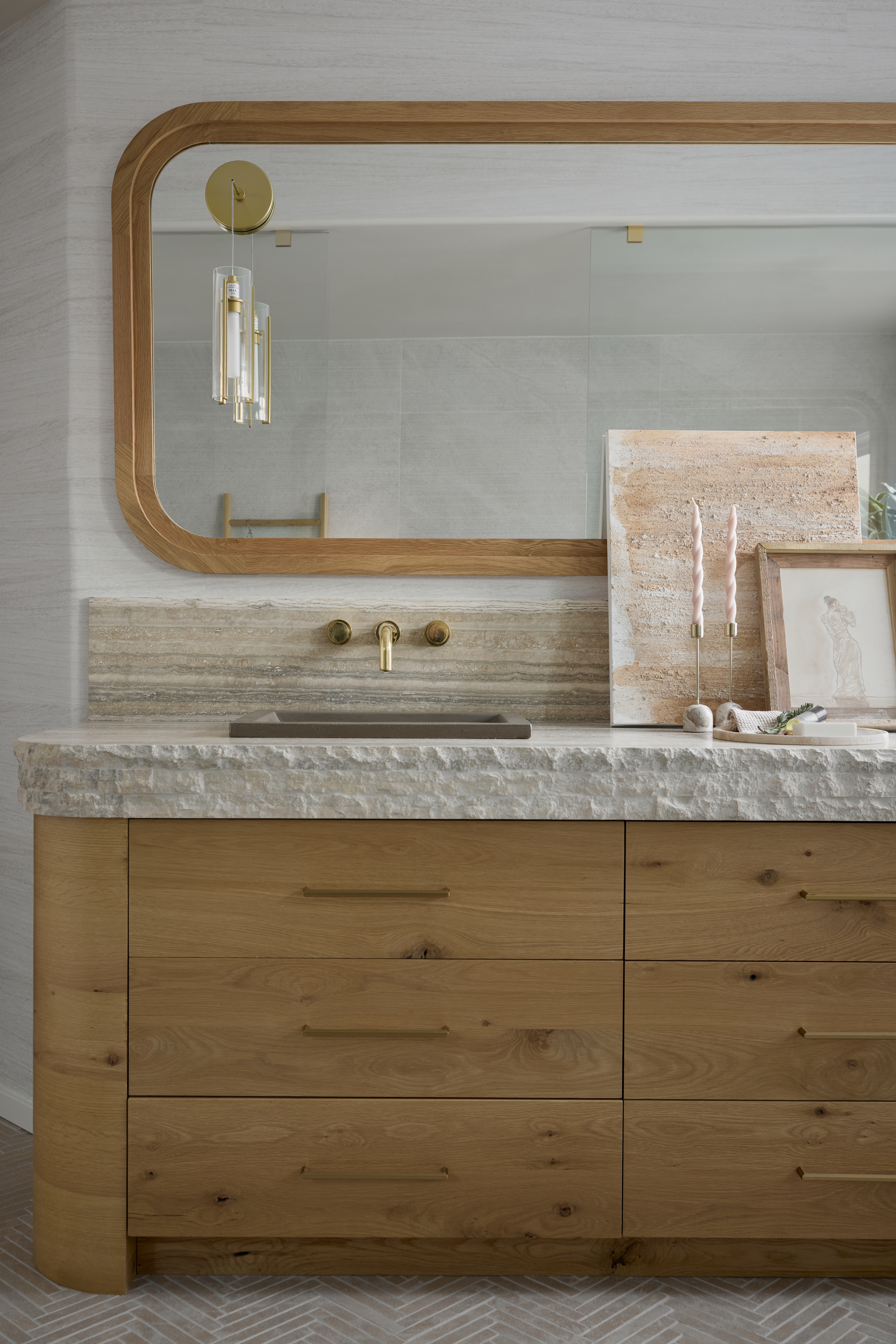Raw edged stone countertop featuring a concrete sink and chevron print tile floor