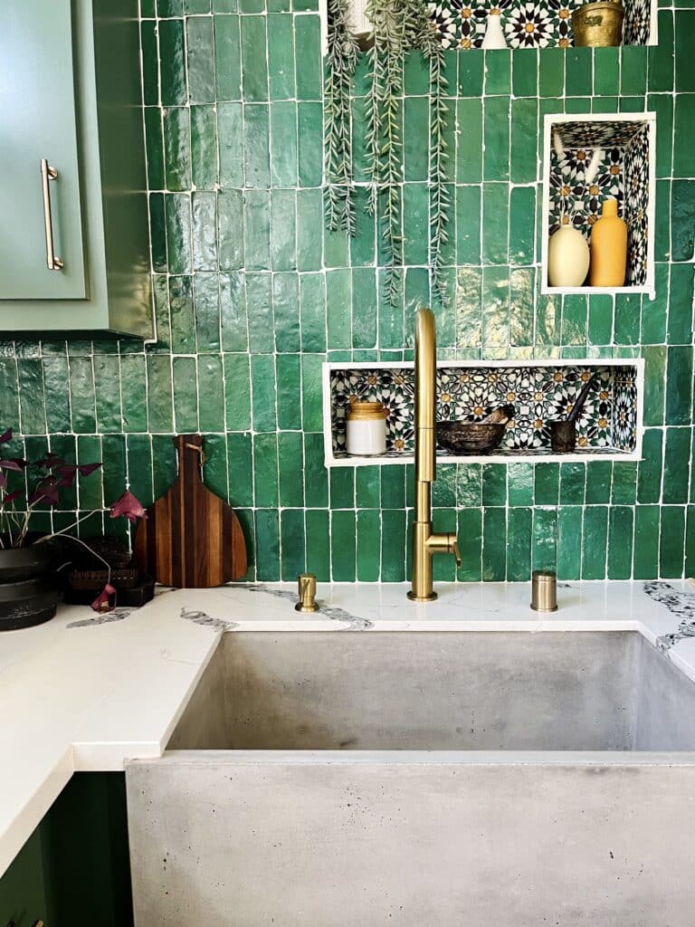 Image of Native Trails NativeStone concrete sink featuring an emerald green tile back drop designed by interior designer Hema Persad and featured in Architectural Digest.