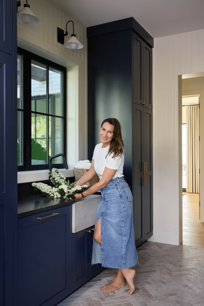 Organic modern mudroom with rich, navy blue cabinets and an organic chevron floor in dove grey.