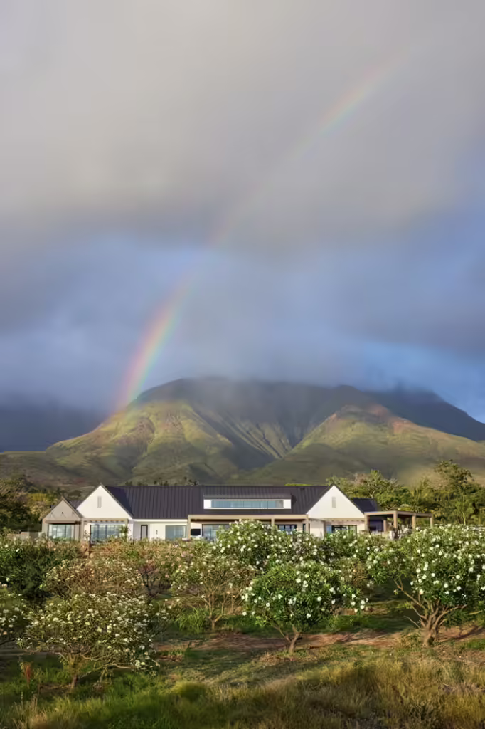 Vacation home design takes center stage in this modern farmhouse Maui retreat.